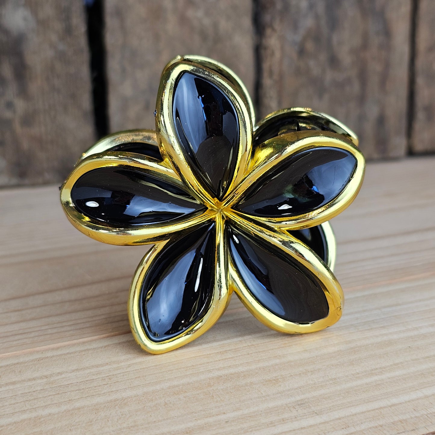 Pince cheveux fleur dorée et noir